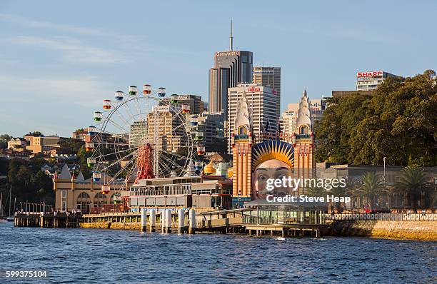 luna park amusement park and sydney city, australia - luna park sydney stock-fotos und bilder