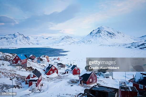 inuit village of kulusuk in winter, greenland - grönland stock-fotos und bilder