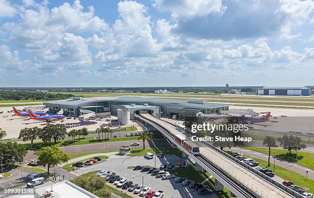 tampa international airport with trains to the terminal building, tampa, florida, usa - airport terminal stock pictures, royalty-free photos & images