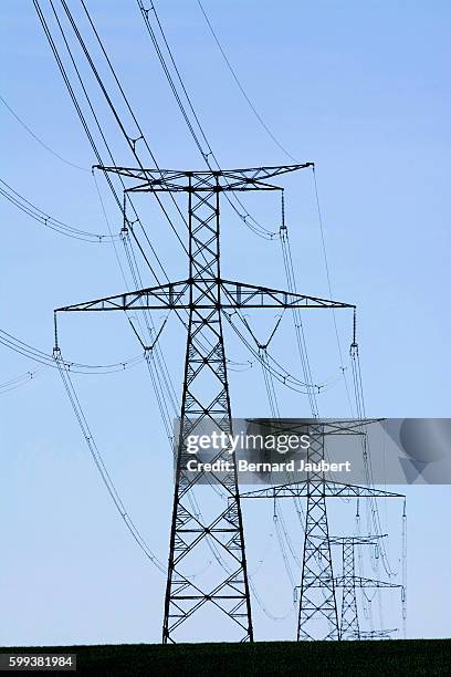 electricity pylons, france, europe - bernard jaubert stock pictures, royalty-free photos & images