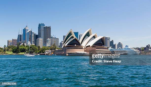 central business district of sydney and the opera house with p&o pacific pearl cruise ship docked in the harbor, australia - sydney stock pictures, royalty-free photos & images