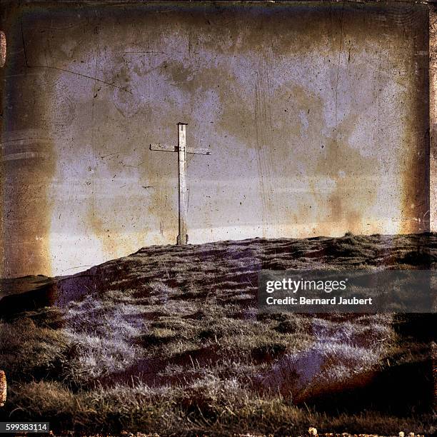 wooden cross on a hillside - art-effect image - bernard jaubert stock pictures, royalty-free photos & images