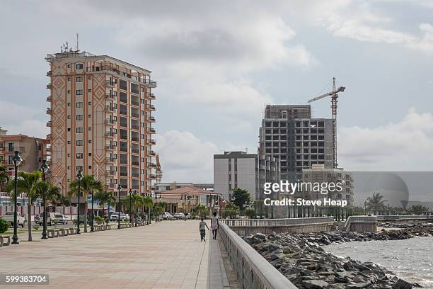 building exterior of large new apartment or hotel buildings on promenade seafront in bata, equatorial guinea - equatorial guinea stockfoto's en -beelden