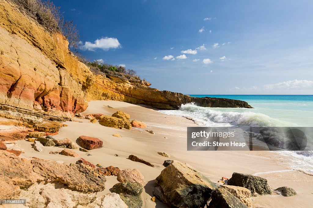 Sandstone cliffs frame Cupecoy Beach on Sint Maarten St Martin Caribbean