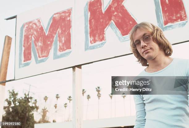 Songwriter Warren Zevon stands in a parking lot. Zevon had a hit with the song "Werewolf in London" and others, including Linda Ronstadt, covered his...