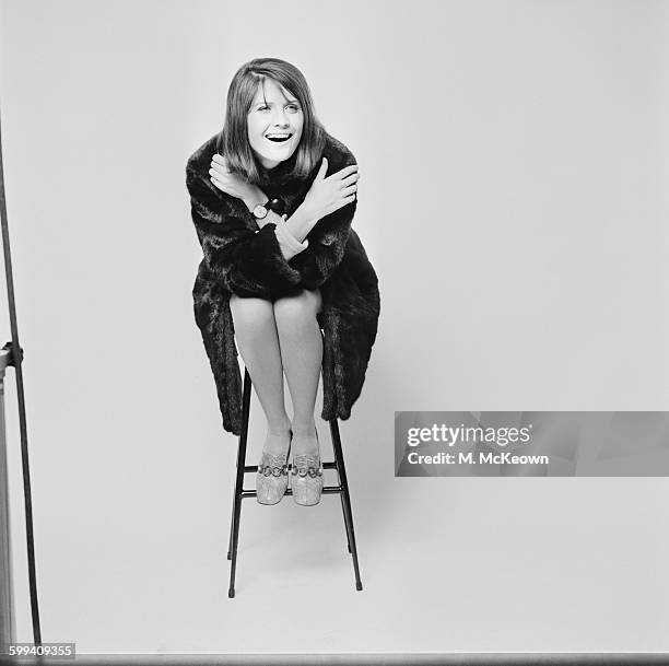 English pop singer Sandie Shaw models a mink coat, UK, 3rd November 1967.