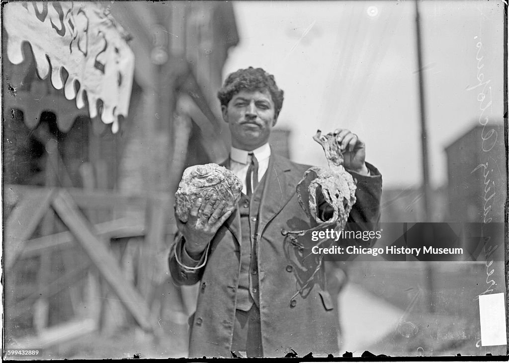 Greek Man Holding Up A Dried Octopus