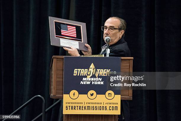 An american flag that was presented to Leonard Nimoy by NASA after it was flown to space on board the shuttle Atlantis is auctiond off during "Star...