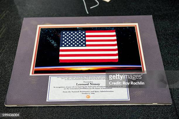 An american flag that was presented to Leonard Nimoy by NASA after it was flown to space on board the shuttle Atlantis is auctiond off during "Star...