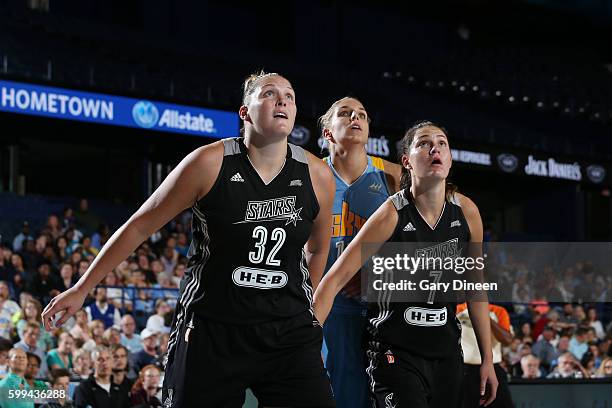 Jayne Appel-Marinelli and Haley Peters of the San Antonio Stars fights for position against Elena Delle Donne of the Chicago Sky on September 4, 2016...