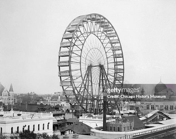 View of the Ferris wheel on the Midway Plaisance at the World's Columbian Exposition world's fair, Chicago, Illinois, 1893.