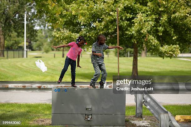 Kaelynn Lott, a resident at the West Calumet Housing Complex who tested positive for lead poisoning dances with her brother Kash Lott on September 4,...