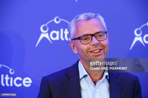 Telecom Company Altice N.V group CEO and CEO of SFR Michel Combes poses prior to a press conference in Paris on September 5, 2016.