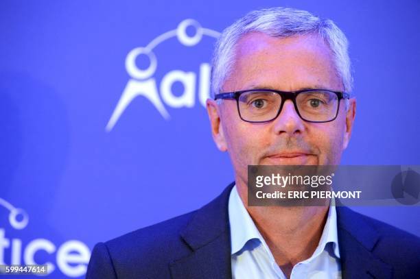 Telecom Company Altice N.V group CEO and CEO of SFR Michel Combes poses prior to a press conference in Paris on September 5, 2016.