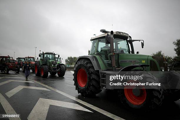 French businesses owners farmers and locals blockade the main road into the Port of Calais as they wait the arrival of convoy of trucks protesting...