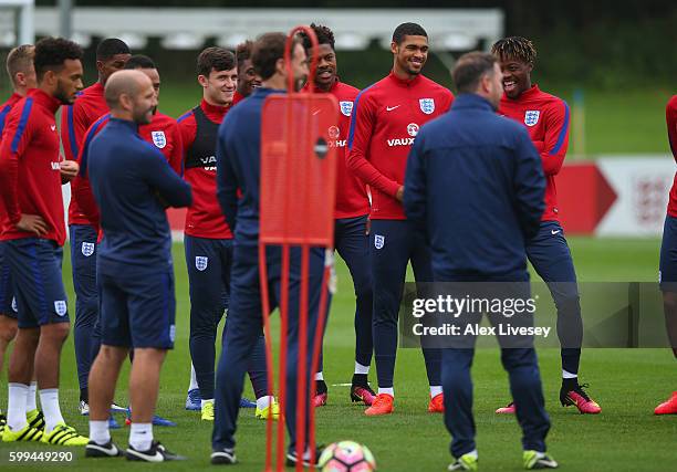 Gareth Southgate the manager of England U21's talks with his team prior to a training session at St Georges Park on September 5, 2016 in...