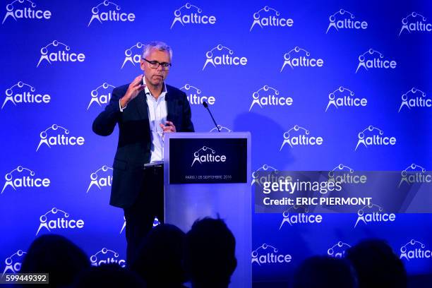 Telecom Company Altice NV group CEO and CEO of SFR Michel Combes talks during a press conference on September 5, 2016 in Paris.