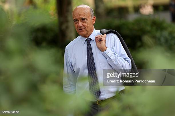 Alain Juppe, Mayor of Bordeaux and Les Republicains presidential candidate hopeful takes a walk after a press conference at Bordeaux metropole on...