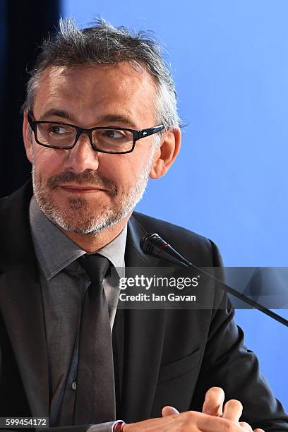 Jaeger LeCoultre Communications Director Laurent Vinay listens as director Amir Naderi speaks during the press conference for 'Mountain' and before...