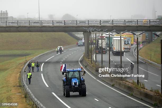 French farmers blockade the main A16 motorway into the Channel Tunnel terminal protesting against the Jungle migrant camp on September 5, 2016 in...