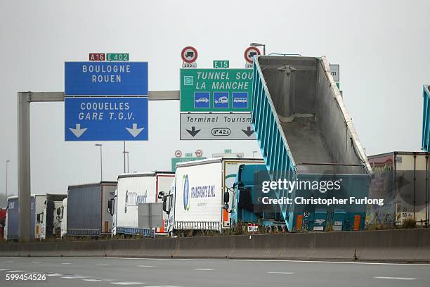 French farmers, truckers and local business owners blockade the main A16 motorway into the Channel Tunnel terminal protesting against the Jungle...