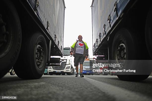 French farmers, truckers and local business owners blockade the main A16 motorway into the Channel Tunnel terminal protesting against the Jungle...