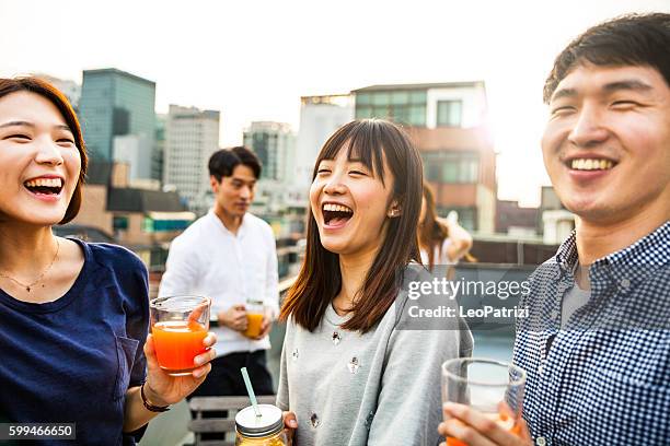 friends meeting and party on seoul rooftop, south korea - jb of south korean stockfoto's en -beelden