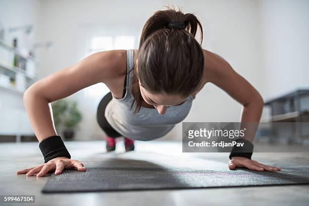 hard workouts - push ups stock pictures, royalty-free photos & images