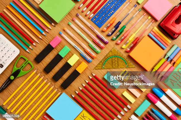 office and school supplies arranged on wooden table - knolling - on the set of the cj e m corp idol school reality television show stockfoto's en -beelden