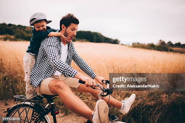 biking with my dad - dad son fun stock pictures, royalty-free photos & images