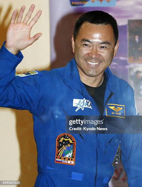 Kazakhstan - Japanese astronaut Akihiko Hoshide waves after a press conference in Baikonur, Kazakhstan, on July 13, 2012. He will board Russia's...