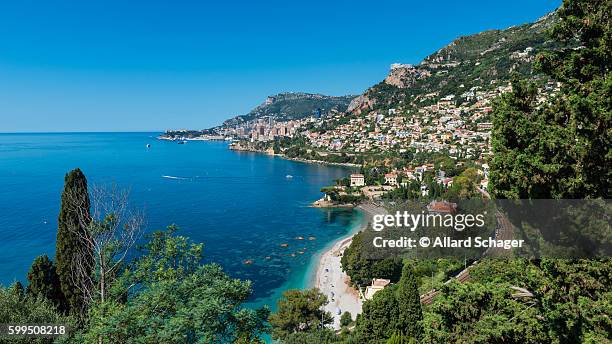bay of roquebrune southern france with monaco in the distance - monaco stock pictures, royalty-free photos & images
