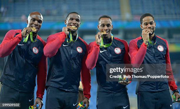 Gold medalists Arman Hall, Tony McQuay, Gil Roberts and Lashawn Merritt of the United States stand on the podium during the medal ceremony for the...