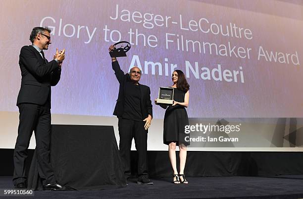 Jaeger LeCoultre Communications Director Laurent Vinay presents director Amir Naderi the Jaeger Le Coultre Glory To The Filmmaker Award on stage at...