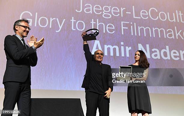Jaeger LeCoultre Communications Director Laurent Vinay presents director Amir Naderi the Jaeger Le Coultre Glory To The Filmmaker Award on stage at...