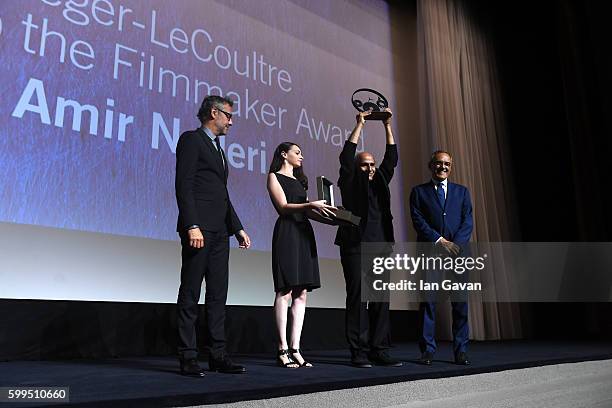Jaeger LeCoultre Communications Director Laurent Vinay presents director Amir Naderi the Jaeger Le Coultre Glory To The Filmmaker Award on stage as...