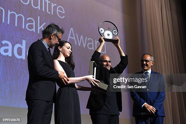 Jaeger LeCoultre Communications Director Laurent Vinay presents director Amir Naderi the Jaeger Le Coultre Glory To The Filmmaker Award on stage as...