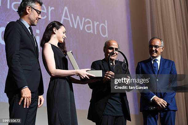 Jaeger LeCoultre Communications Director Laurent Vinay presents director Amir Naderi the Jaeger Le Coultre Glory To The Filmmaker Award on stage as...