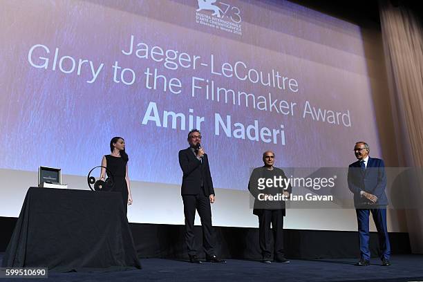 Jaeger LeCoultre Communications Director Laurent Vinay presents director Amir Naderi the Jaeger Le Coultre Glory To The Filmmaker Award on stage as...