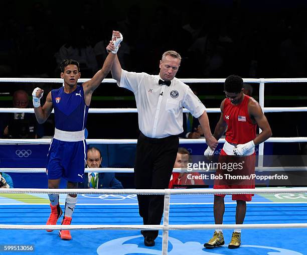 Robeisy Ramirez of Cuba is declared the winner after defeating Shakur Stevenson of the United States during the Men's Bantam Boxing Final on Day 15...