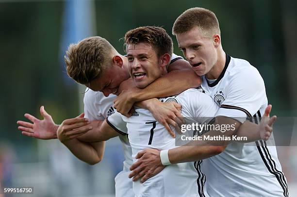 Mats Koehlert of Germany jubilates with Nicklas Shipnoski and Dzenis Burnic after scoring the second goal during the international friendly match...