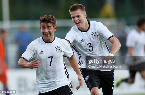 Mats Koehlert of Germany jubilates with team mate Dzenis Burnic after scoring the second goal during the international friendly match between U19...