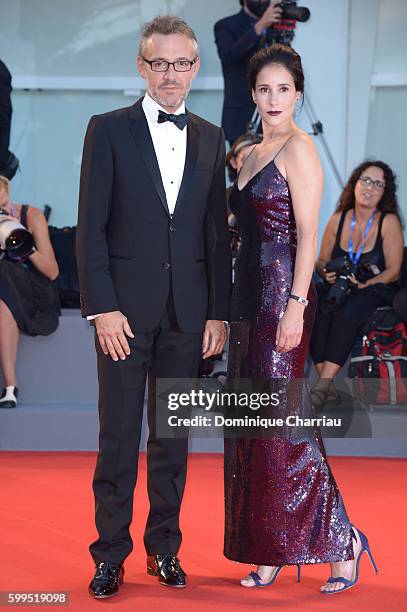 Jaeger LeCoultre Communications Director Laurent Vinay and Olga Sutulova attend the premiere of 'Piuma' during the 73rd Venice Film Festival at Sala...