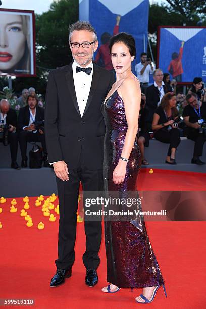 Jaeger LeCoultre Communications Director Laurent Vinay and Olga Sutulova attend the premiere of 'Piuma' during the 73rd Venice Film Festival at Sala...
