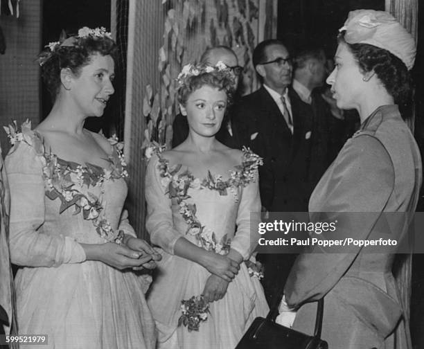 Queen Elizabeth II talks to actresses Dame Peggy Ashcroft and Jane Wenham after watching a performance of William Shakespeare's play 'As You Like...