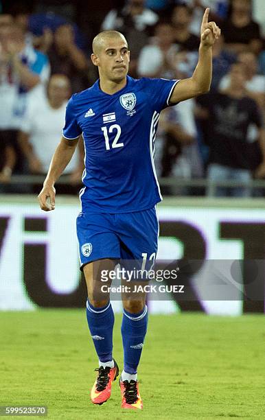 Israel's forward Tal Ben Haim celebrates after scoring during their World Cup 2018 qualification match between Israel and Italy at the Sammy Ofer...