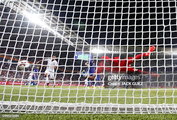 Italy's midfielder Antonio Candreva scores a goal during their World Cup 2018 qualification match between Israel and Italy at the Sammy Ofer Stadium...