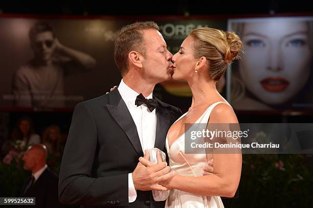 Rocco Siffredi kisses Rosa Caracciolo on the premiere of 'Rocco' during the 73rd Venice Film Festival at Sala Perla on September 5, 2016 in Venice,...