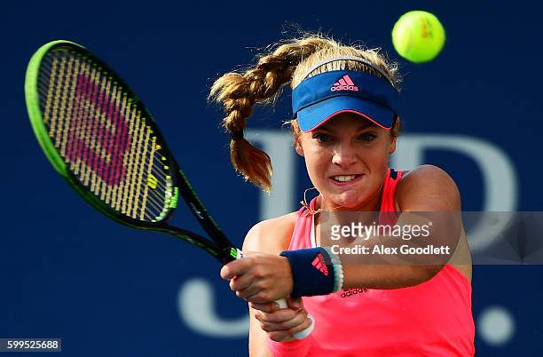 Caty McNally of the United States returns a shot to Bianca Andreescu of Canada during her first round Junior Girl's match on Day Eight of the 2016 US...