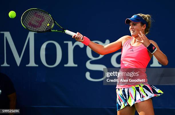 Caty McNally of the United States returns a shot to Bianca Andreescu of Canada during her first round Junior Girl's match on Day Eight of the 2016 US...